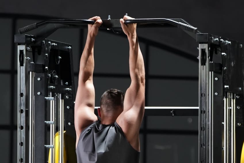 A man is using versatile multi-grip pull-up bar to doing some exercise