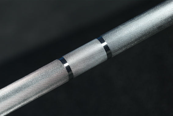 A silver barbell bar.