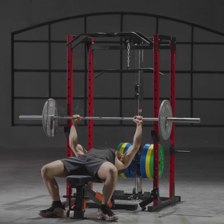 A video of a man working out on gym equipment power rack