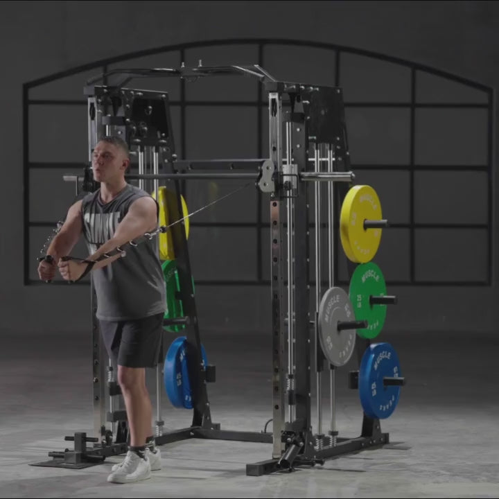 A man is working out on gym equipment smith machine.